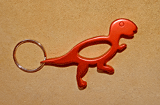 Porte-clés décapsuleur dinosaure Tyrannosaure orange
